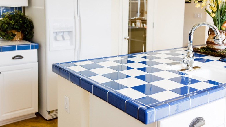 modern kitchen with blue and white tile counters