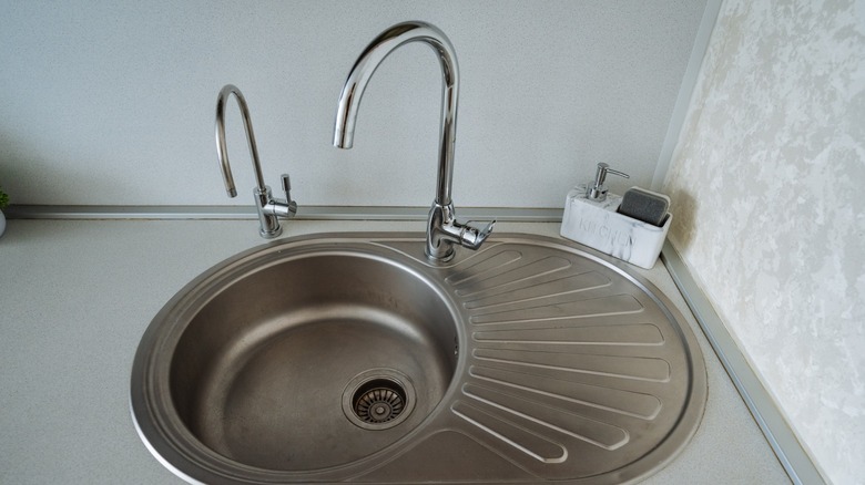 stainless steel sink with two faucets