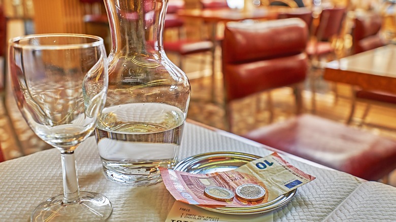 payment of euros on a dinner table