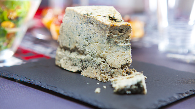 Cabrales blue cheese on a black plate