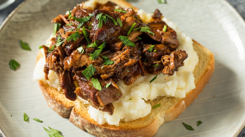 open faced manhattan beef sandwich on toast