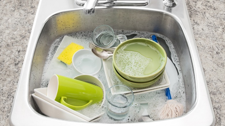 dishes soaking in a sink
