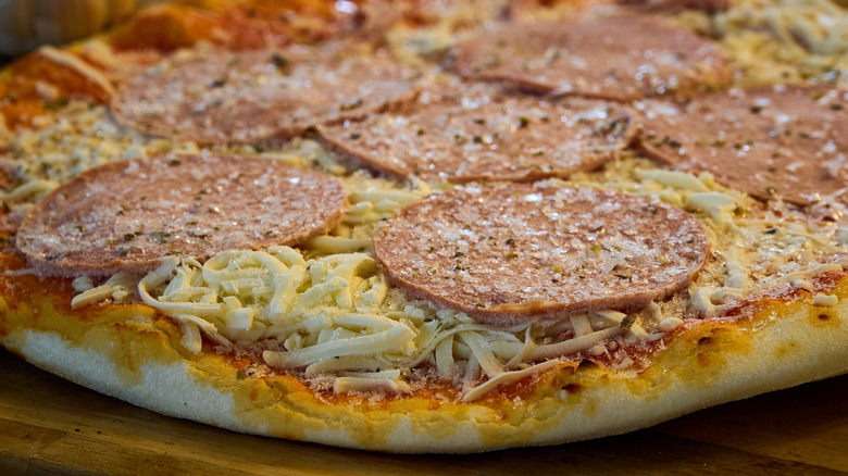 Up close of frozen pepperoni pizza.
