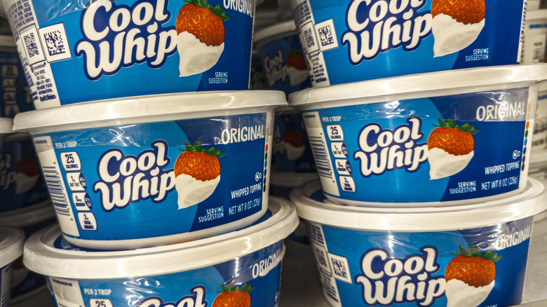 cool whip containers in a freezer case