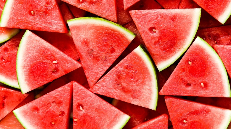 Whole and sliced watermelons.