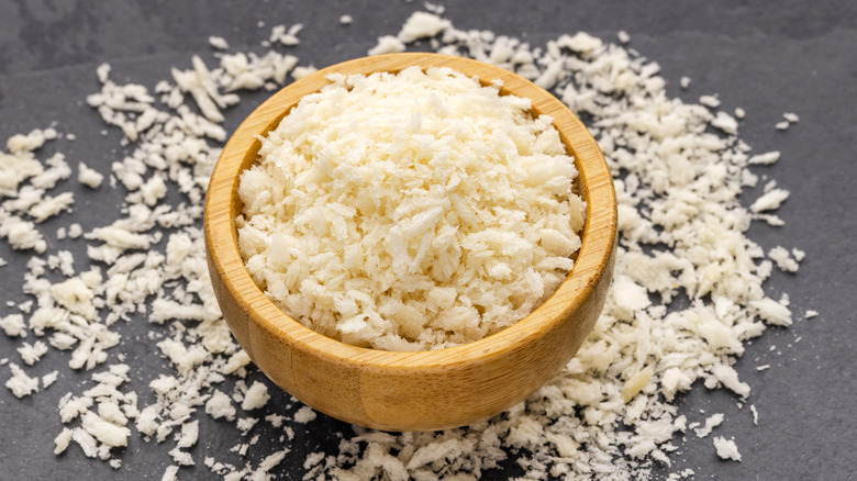 Panko breadcrumbs in a wooden bowl on a dark background