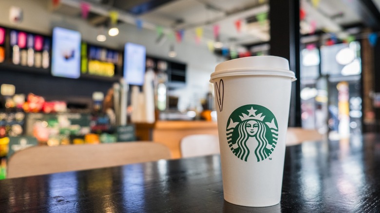 starbucks cup on a cafe table