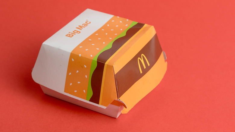mcdonald's big mac box isolated against red background