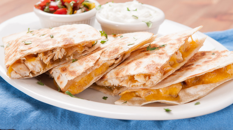 cheese quesadillas arranged on plate