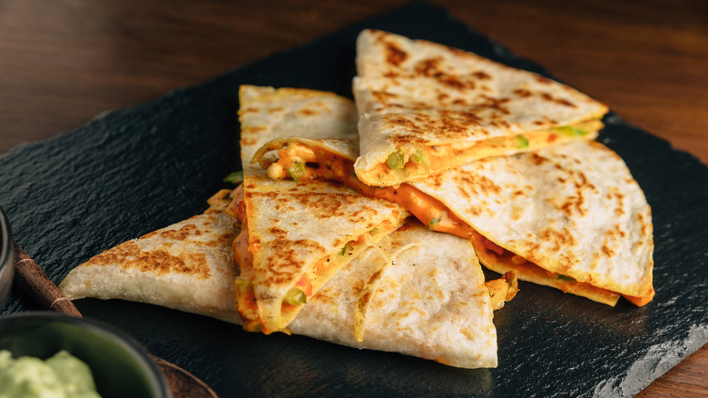 sliced quesadillas on black slab