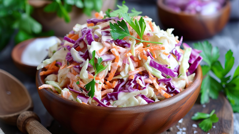 Coleslaw heaped in a wooden bowl