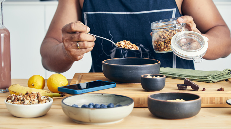 person making a bowl of oatmeal