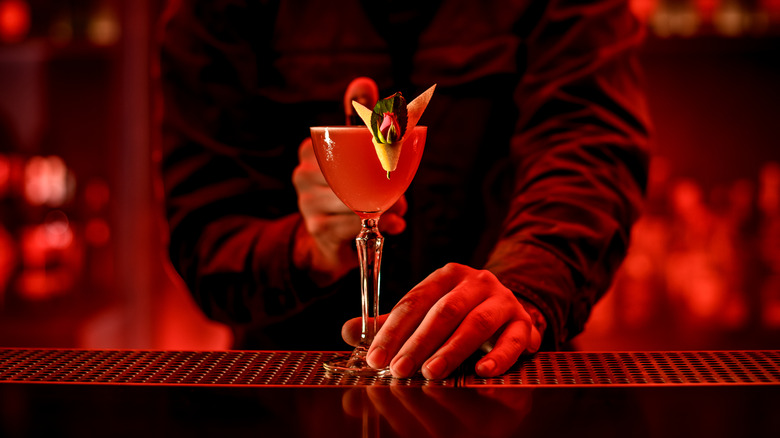 Bartender serving a cocktail