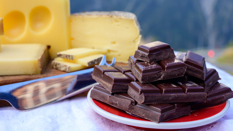 Plate of chocolate next to plate of cheeses