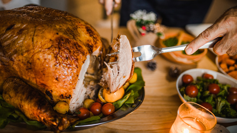 cutting slice from turkey