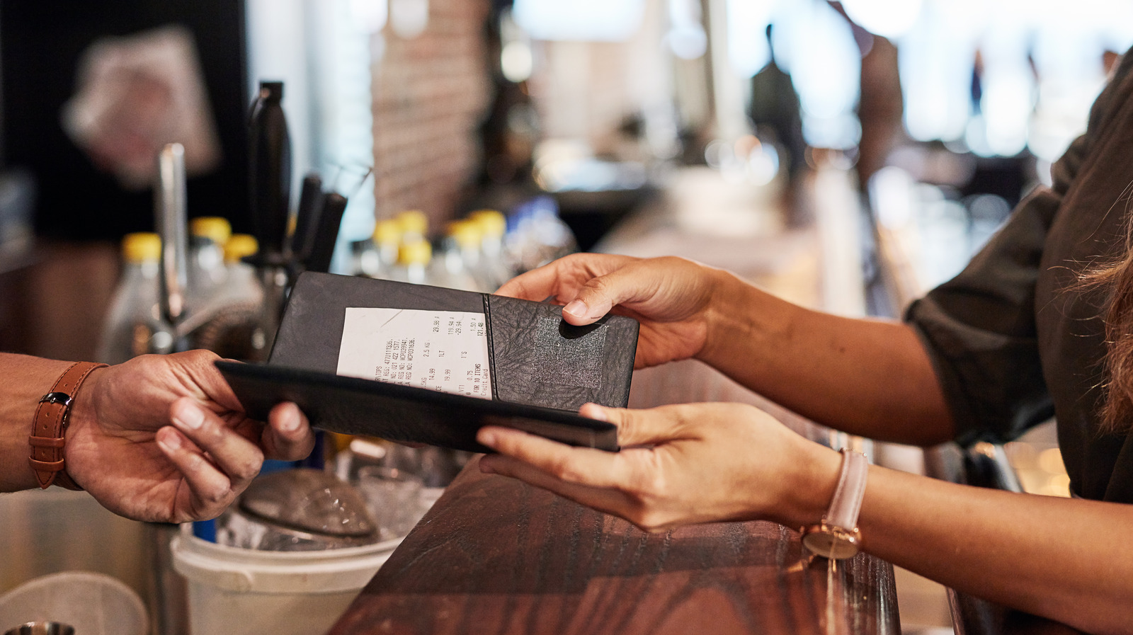 The Restaurant Etiquette Rule You Shouldn't Break When Splitting The Check