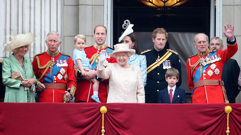 British royal family on balcony waving, including Queen Elizabeth II.