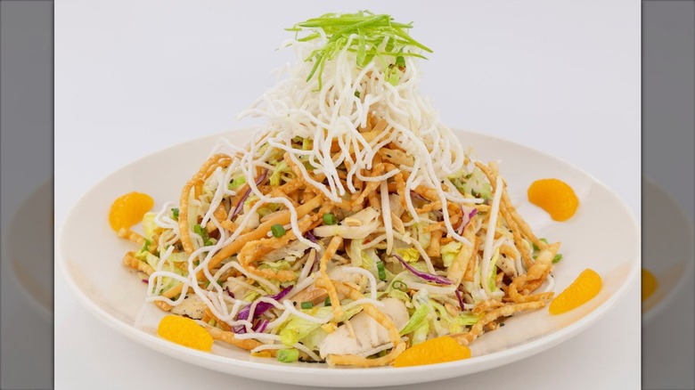 Cheesecake Factory chinese chicken salad on white background