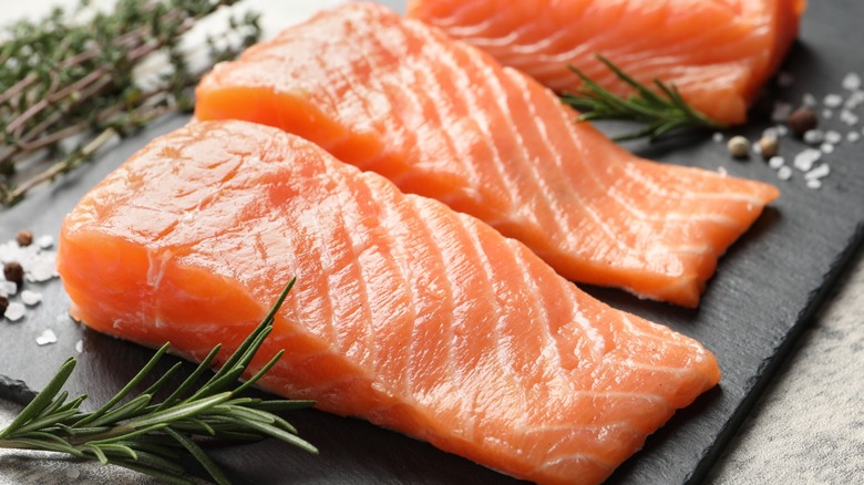 salmon filets on slate board