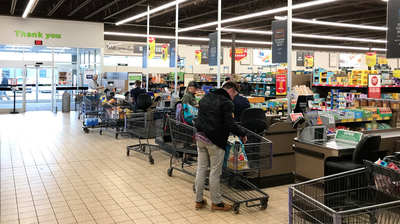 Checkouts of Aldi with many shopping carts
