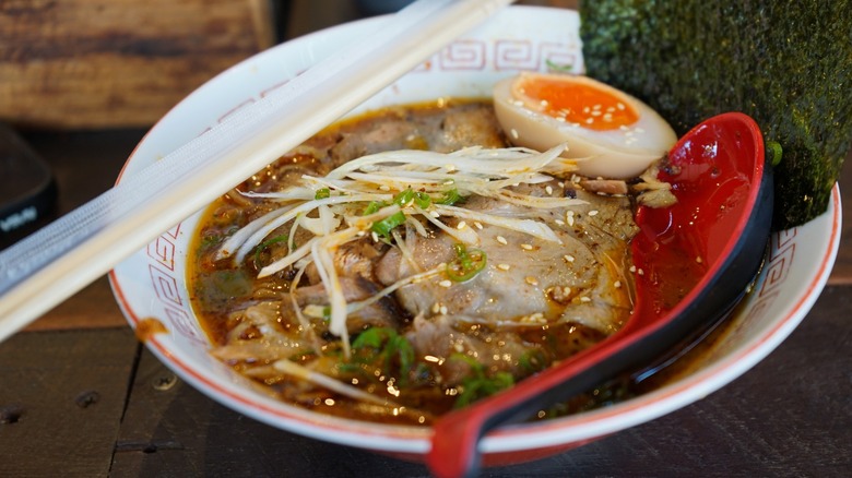 ramen in bowl with meat and soft-boiled egg