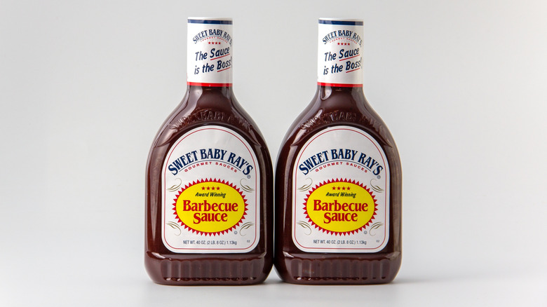 Two Sweet Baby Ray's barbecue sauce bottles on white background