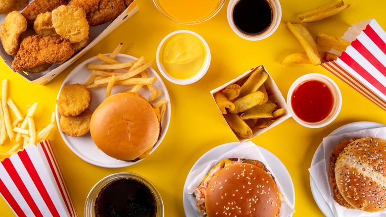 assorted fast food items against yellow background