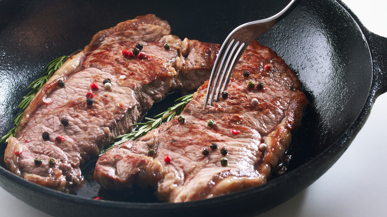 Two steaks in a skillet