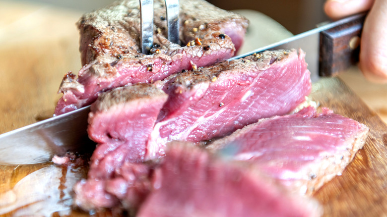 Cutting a medium rare steak
