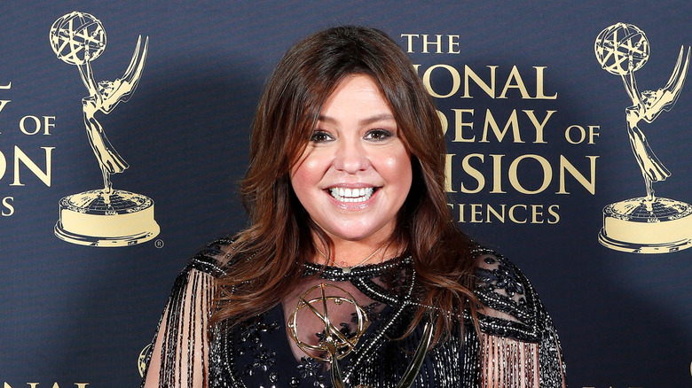 Rachael Ray smiling and holding award