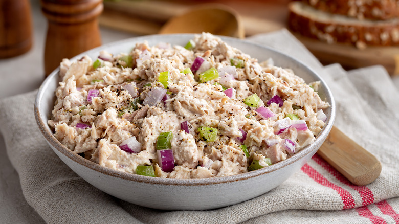 Tuna salad in bowl with veggies