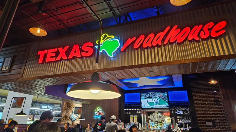 Texas Roadhouse interior with illuminated sign