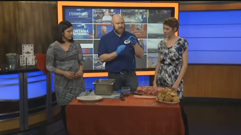 chef with meat probe displays prime rib cooking technique