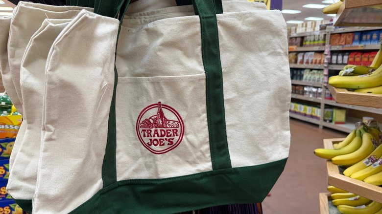trader joe's reusable cloth bags hanging on display