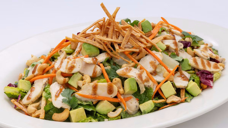 plate of chicken and avocado salad