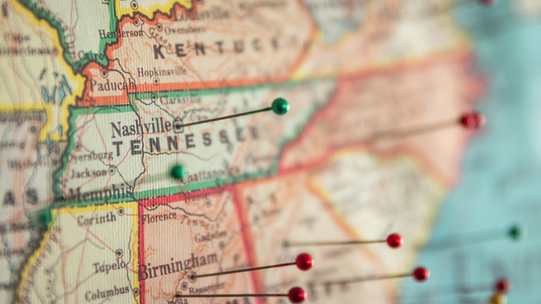 An extreme close-up of a map centered on Nashville, Tennessee, with a pin stuck in the marker