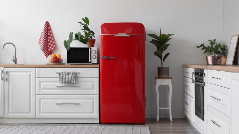 kitchen with focus on red fridge