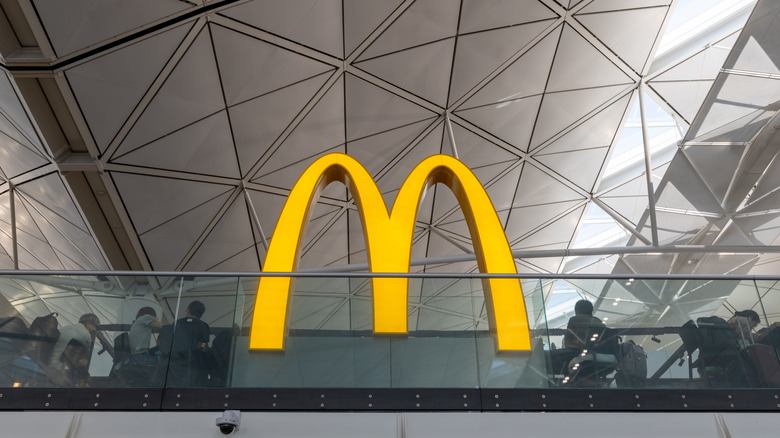 Large illuminated McDonald's sign in interior space