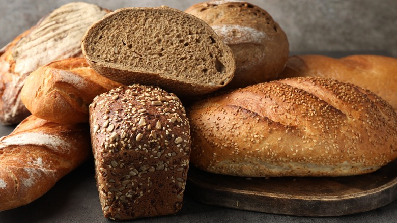multiple rolls and loaves of bread