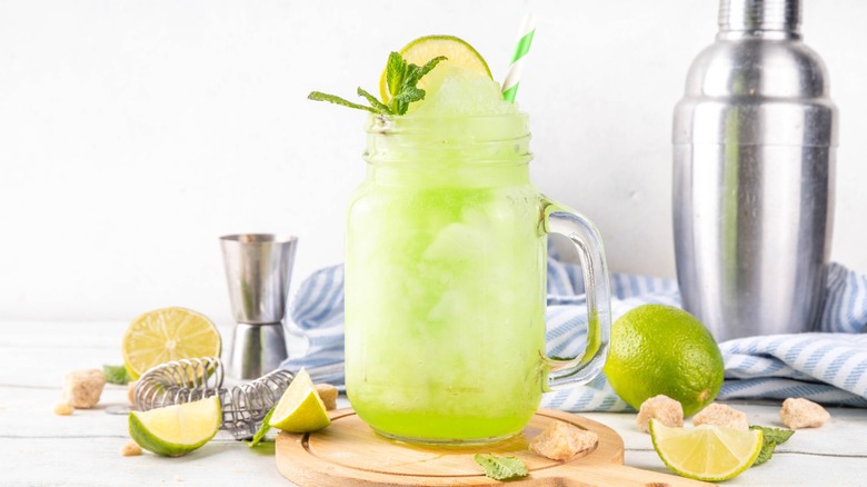 cucumber slushy in glass with straw