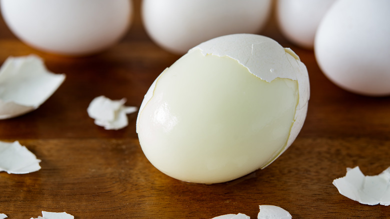 partially peeled hard boiled egg