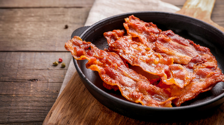 cooked bacon served on black platter