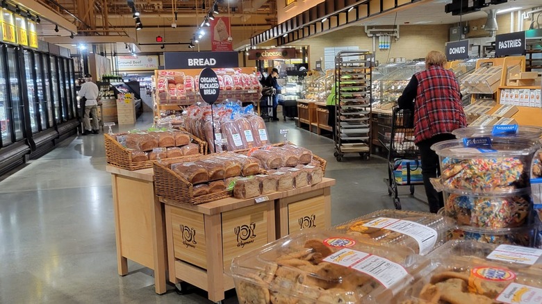 Wegmans bakery section with bread and other baked goods on display.