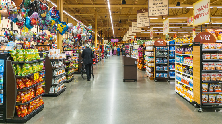 wegmans checkout lanes with signs and balloons