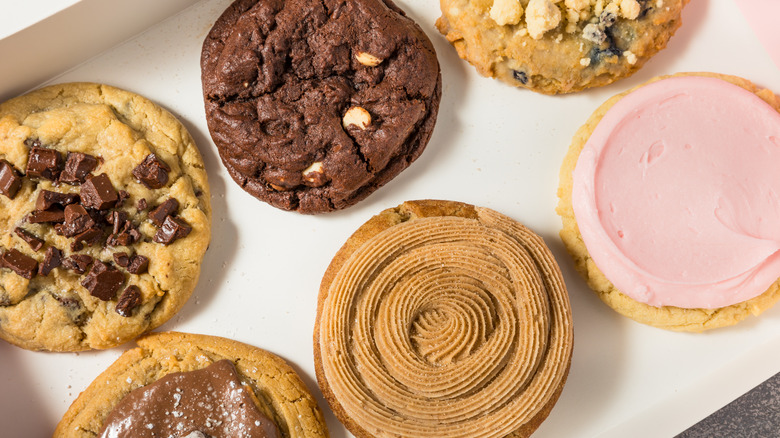 closeup of six Crumbl cookies in a box