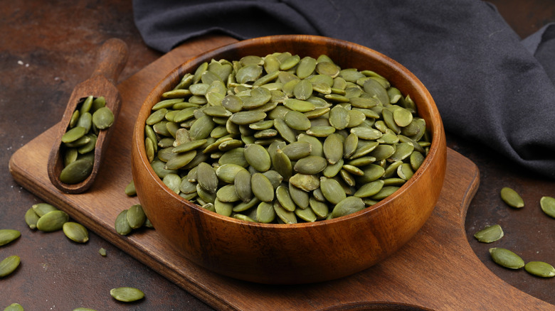 Pumpkin seeds in a wooden bowl