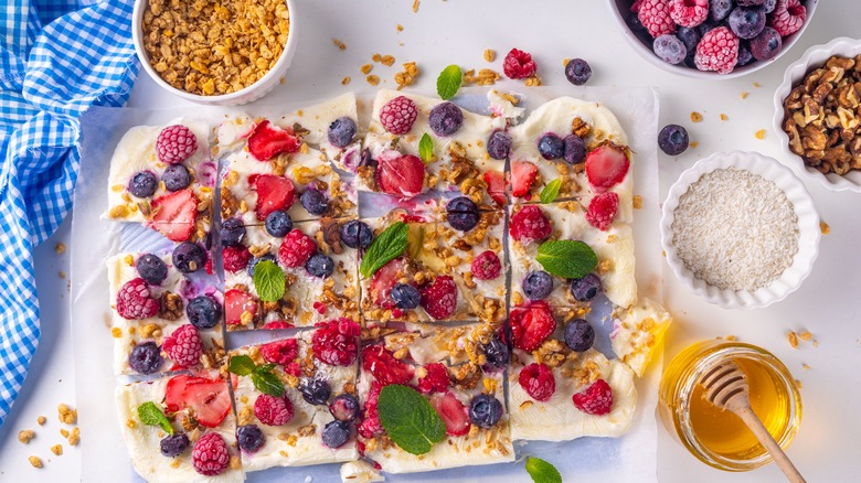 A sheet of homemade frozen yogurt bark cut up into sections