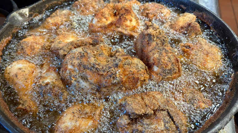 A skillet of chicken being fried at Wagner's Village Inn