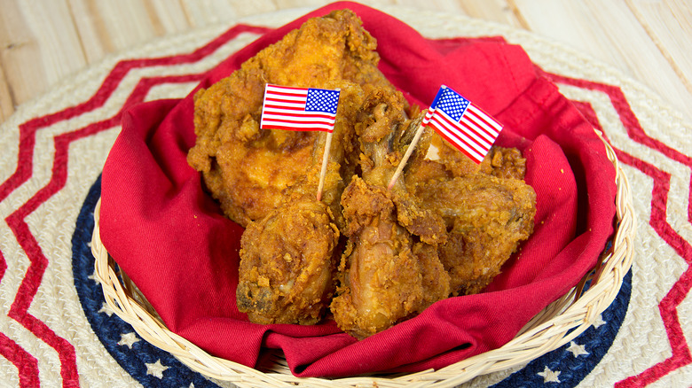 fried chicken on a red napkin with American flag decoration
