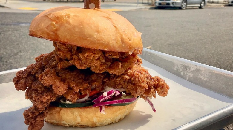 A fried chicken burger from Basilisk